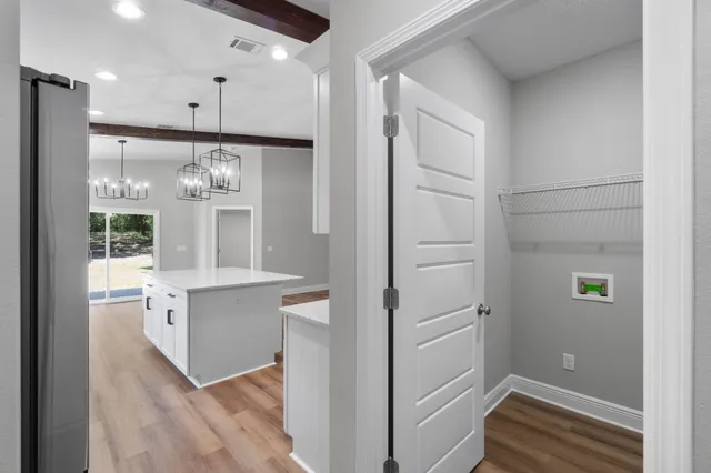 a view of kitchen with wooden floor