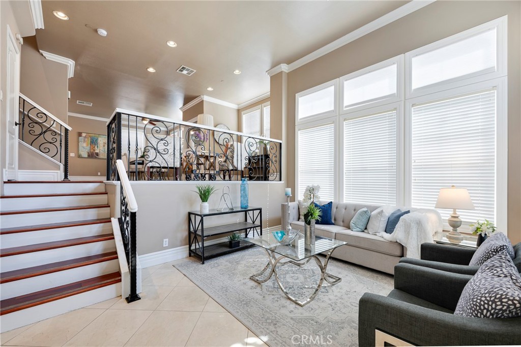 8543 Kendra Loop Orange, CA 92867 - Photo 1 of 1 a living room with furniture and wooden floor
