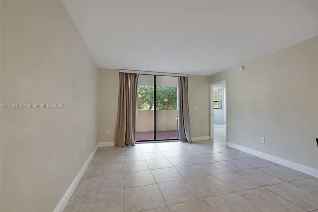 a view of a livingroom with an empty space and window