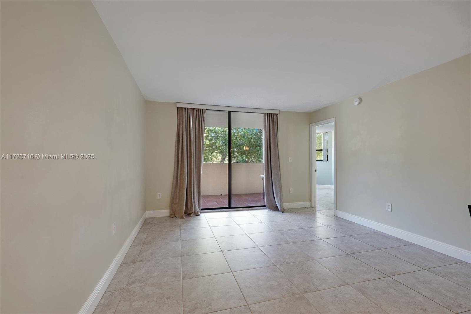7451 Northwest 16th Street, Unit 210 Plantation, FL 33313 - Photo 13 of 40 a view of a livingroom with an empty space and window