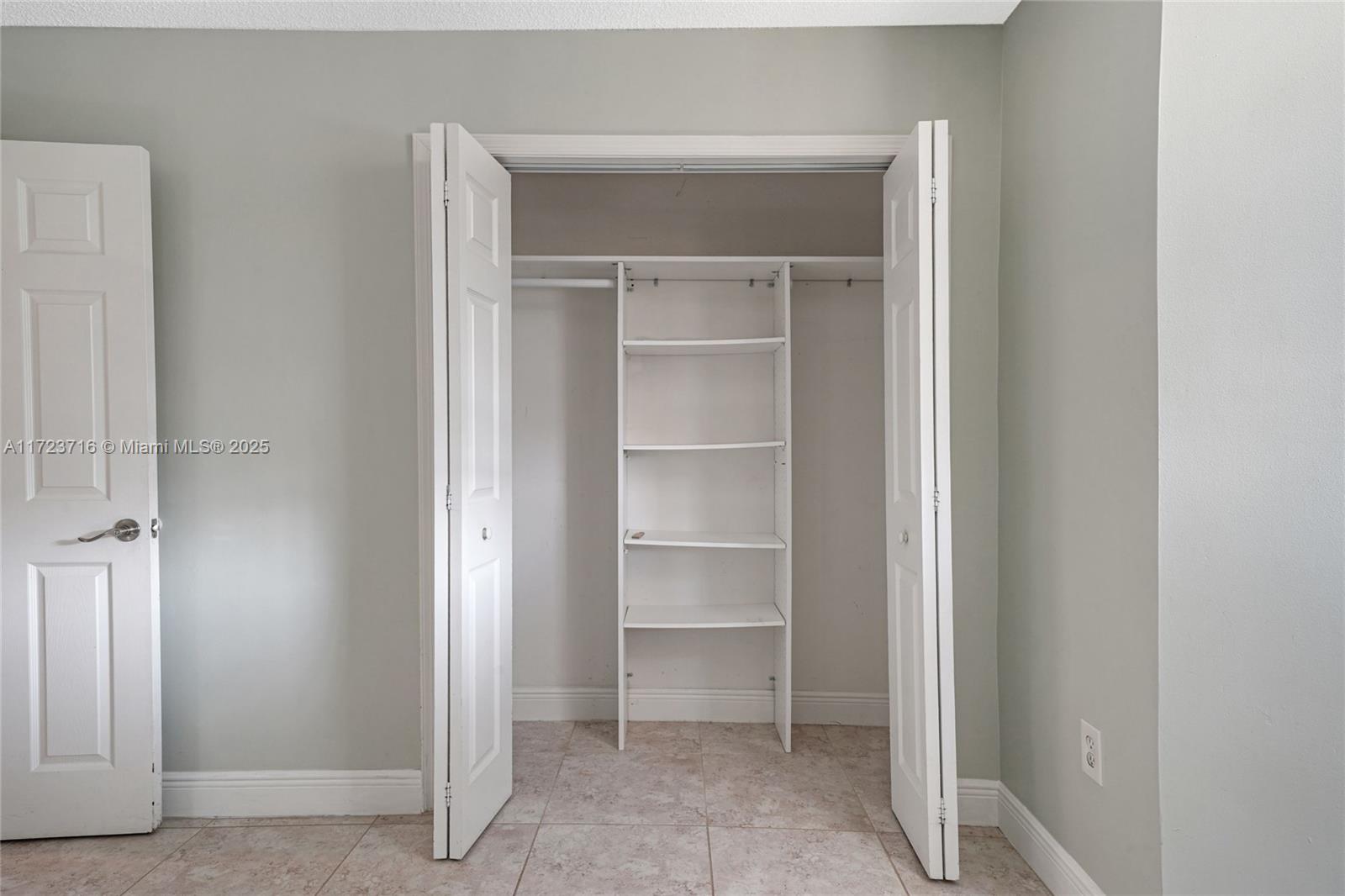7451 Northwest 16th Street, Unit 210 Plantation, FL 33313 - Photo 19 of 40 a view of walk in closet with empty racks
