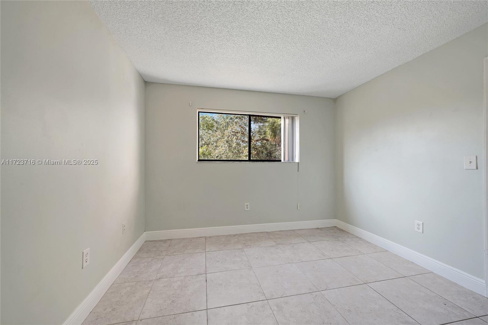 7451 Northwest 16th Street, Unit 210 Plantation, FL 33313 - Photo 20 of 40 an empty room with windows