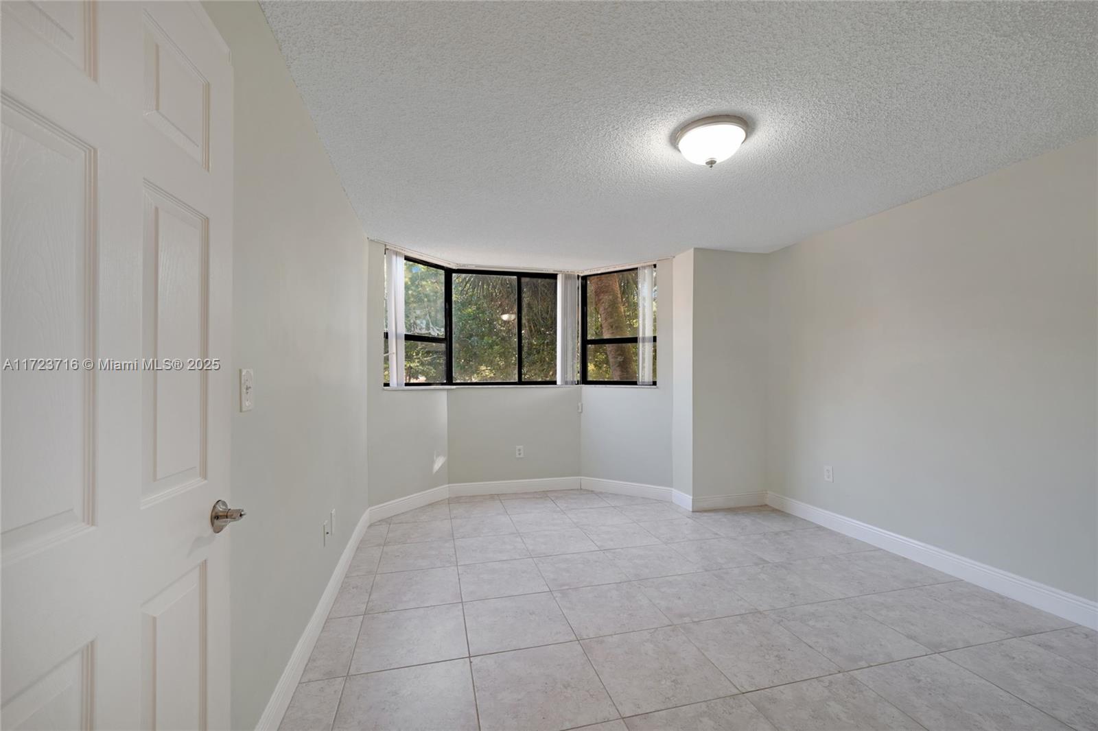 7451 Northwest 16th Street, Unit 210 Plantation, FL 33313 - Photo 24 of 40 an empty room with windows