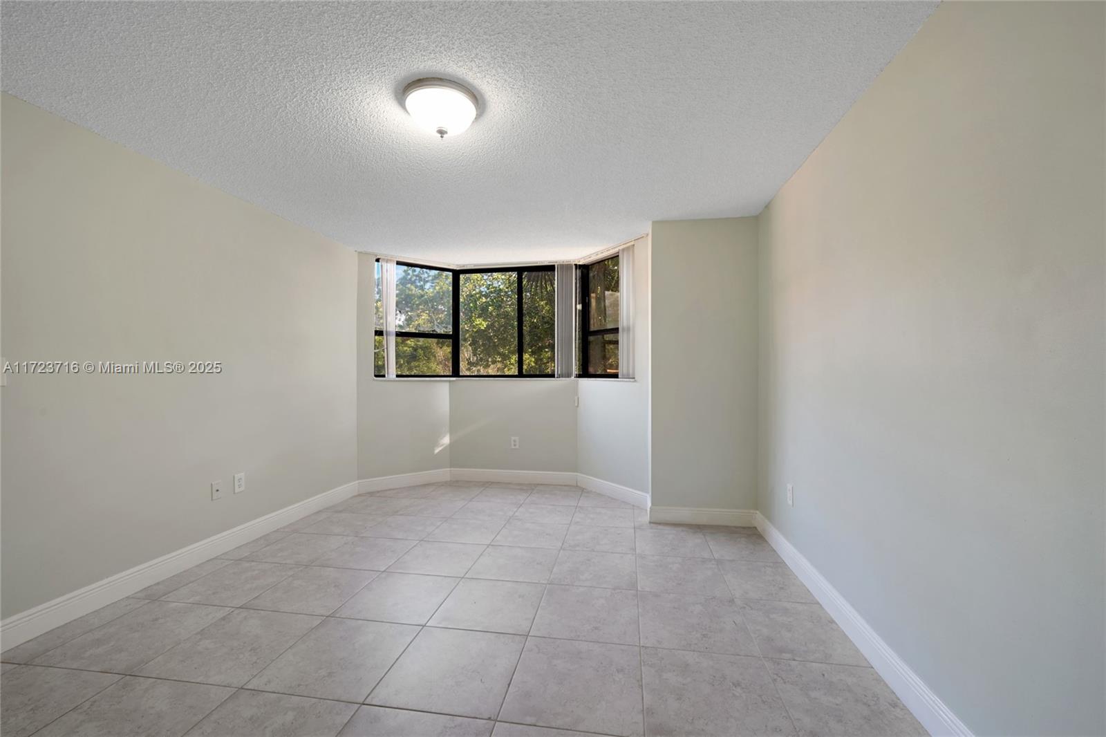 7451 Northwest 16th Street, Unit 210 Plantation, FL 33313 - Photo 27 of 40 an empty room with windows