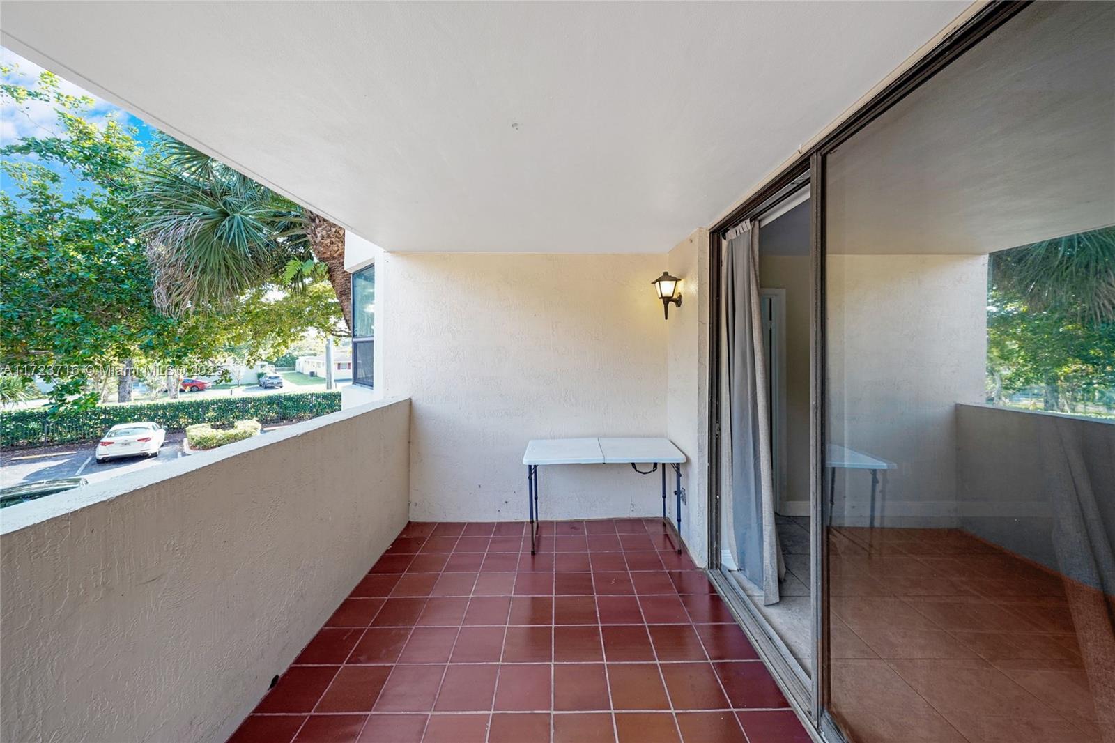 7451 Northwest 16th Street, Unit 210 Plantation, FL 33313 - Photo 30 of 40 a view of a balcony