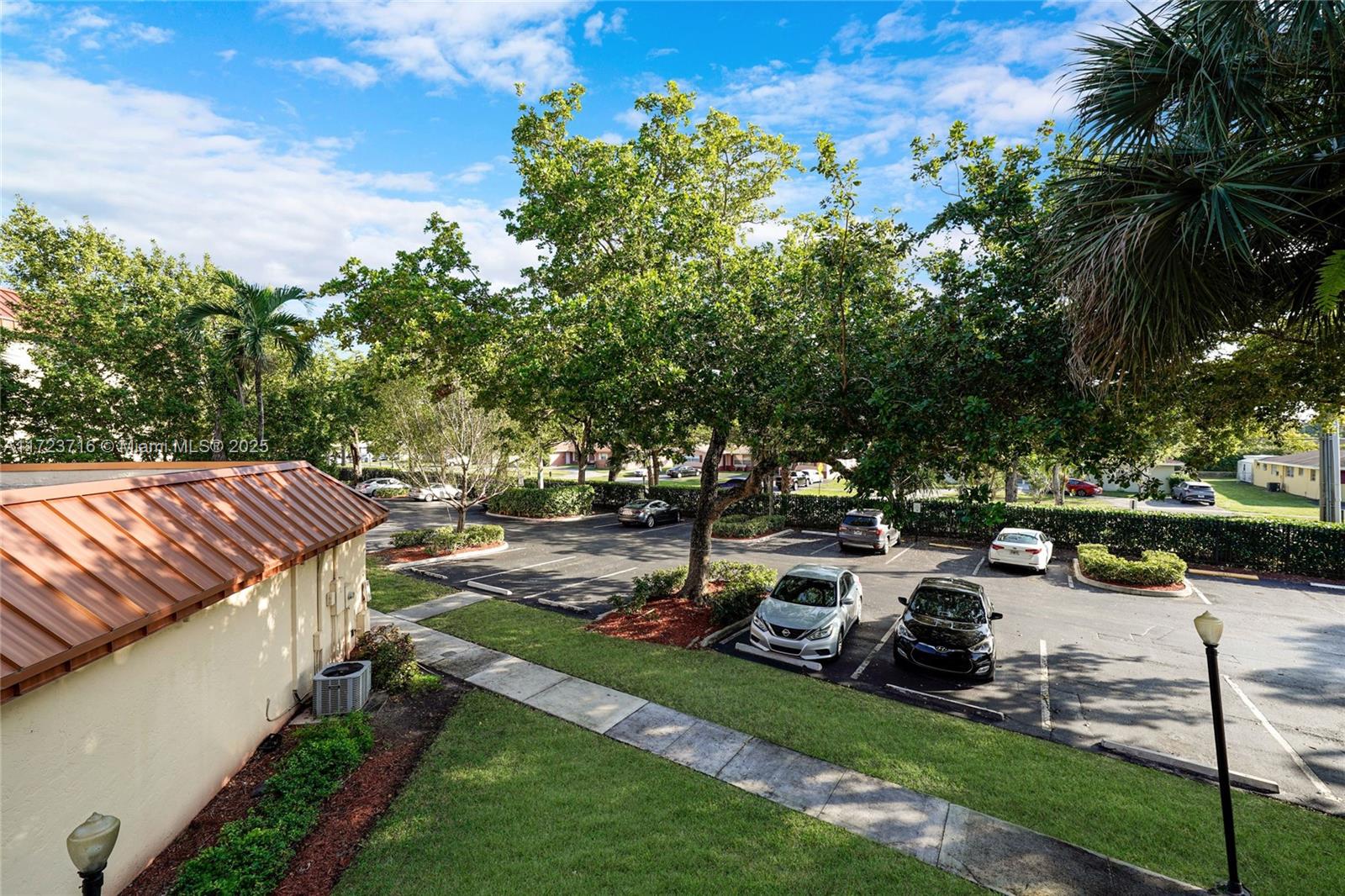 7451 Northwest 16th Street, Unit 210 Plantation, FL 33313 - Photo 33 of 40 a view of a backyard with sitting area