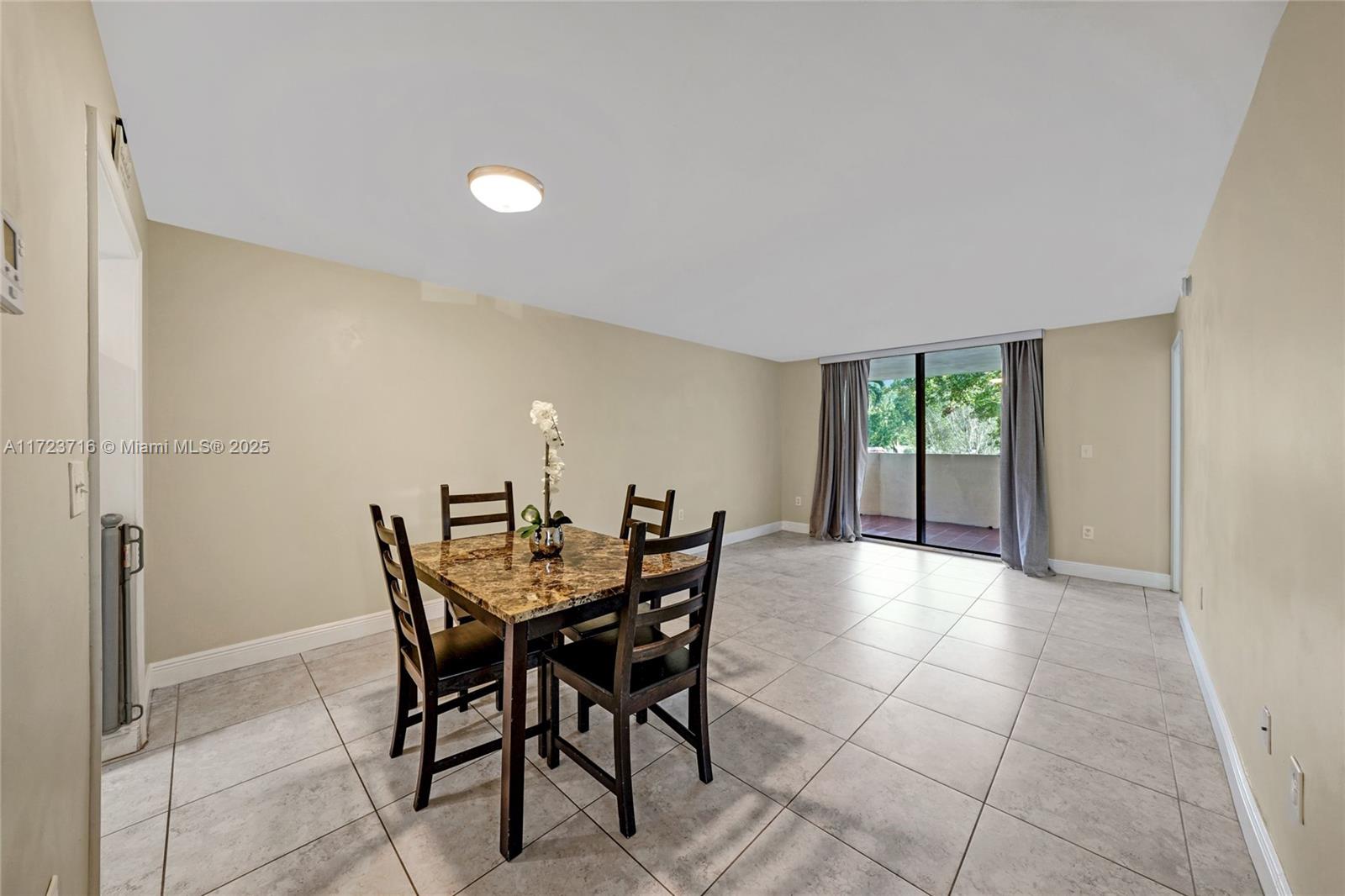 7451 Northwest 16th Street, Unit 210 Plantation, FL 33313 - Photo 8 of 40 a view of a dining room with furniture and a potted plant