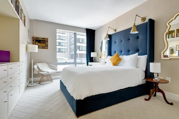 a bedroom with a bed and window