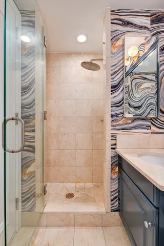 a bathroom with a shower and a sink