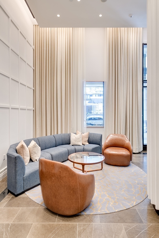 1 Avery Street, Unit 10D Boston, MA 02111 - Photo 19 of 21 a living room with furniture and a large window
