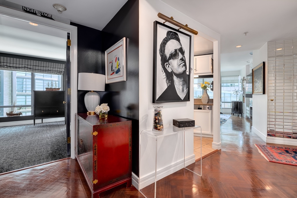 1 Avery Street, Unit 10D Boston, MA 02111 - Photo 3 of 21 a view of living room with furniture and wooden floor