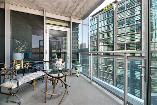 a room with lots of furniture and windows