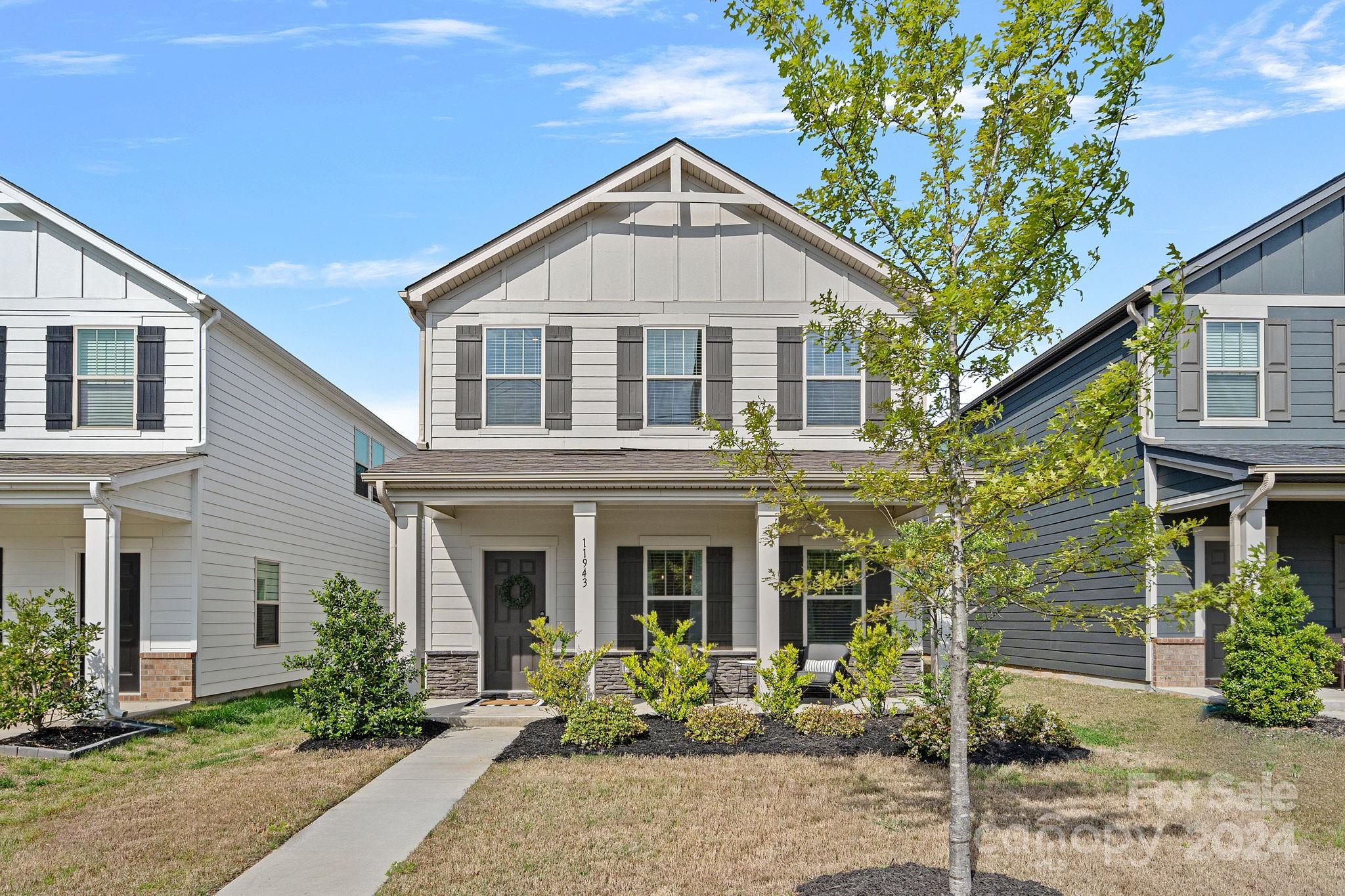 11943 Old Statesville Road Huntersville, NC 28078 - Photo 1 of 31 a front view of a house with garden