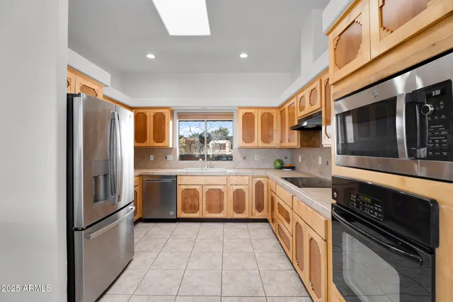 a white bath tub sitting next to a window