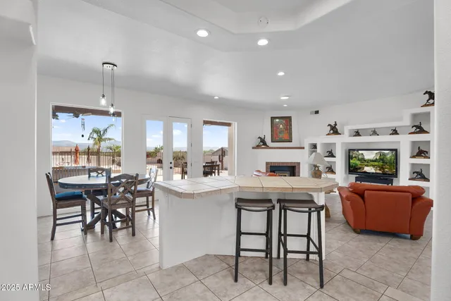 a bedroom with furniture and a flat screen tv