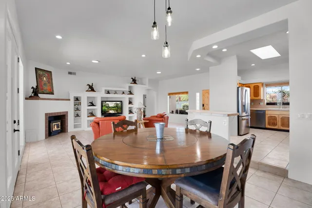 a room with a bed and a chandelier