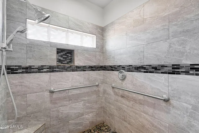 a living room with furniture a dining table and chairs