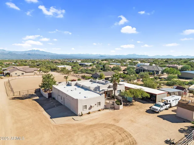 a view of balcony with wooden floor and seating space