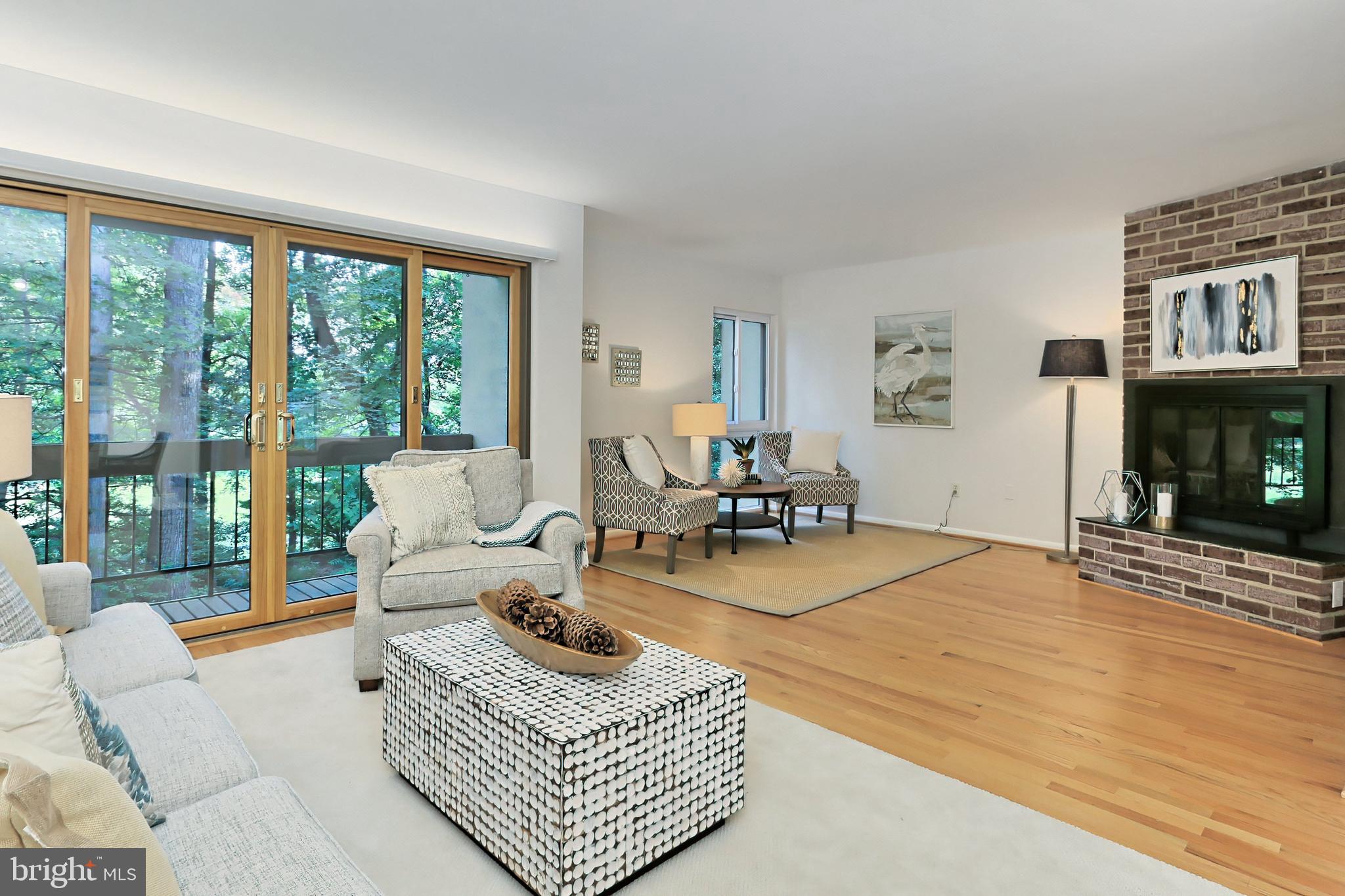 11704 Newbridge Court Reston, VA 20191 - Photo 12 of 64 Open Living Room with wall of sliding doors