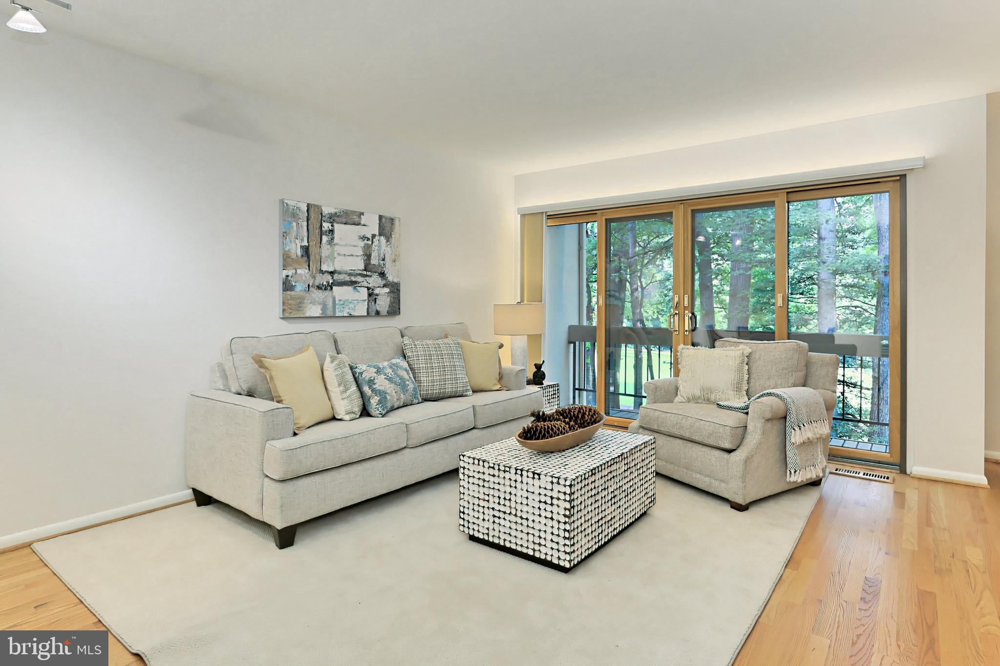11704 Newbridge Court Reston, VA 20191 - Photo 15 of 64 Accent lighting highlights the glass doors