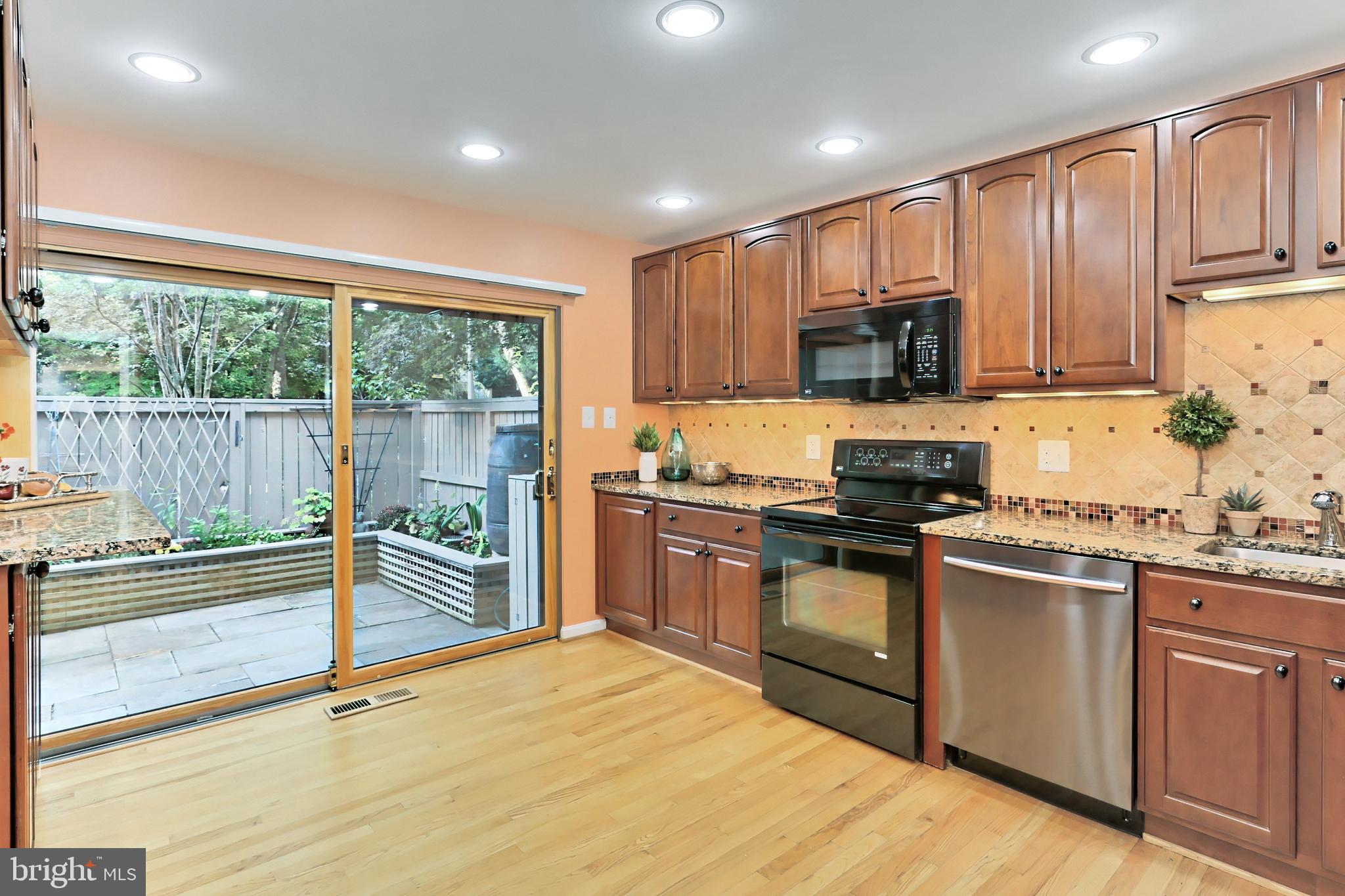 11704 Newbridge Court Reston, VA 20191 - Photo 7 of 64 New Anderson sliding door to private patio