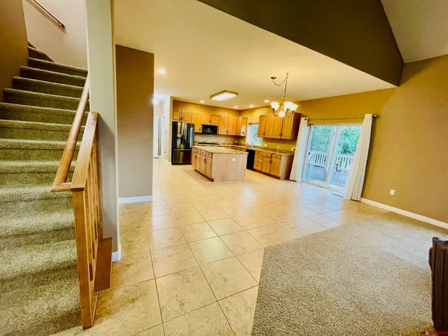 a view of kitchen with furniture and wooden floor