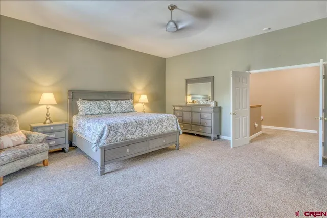 a bedroom with a bed and a couch