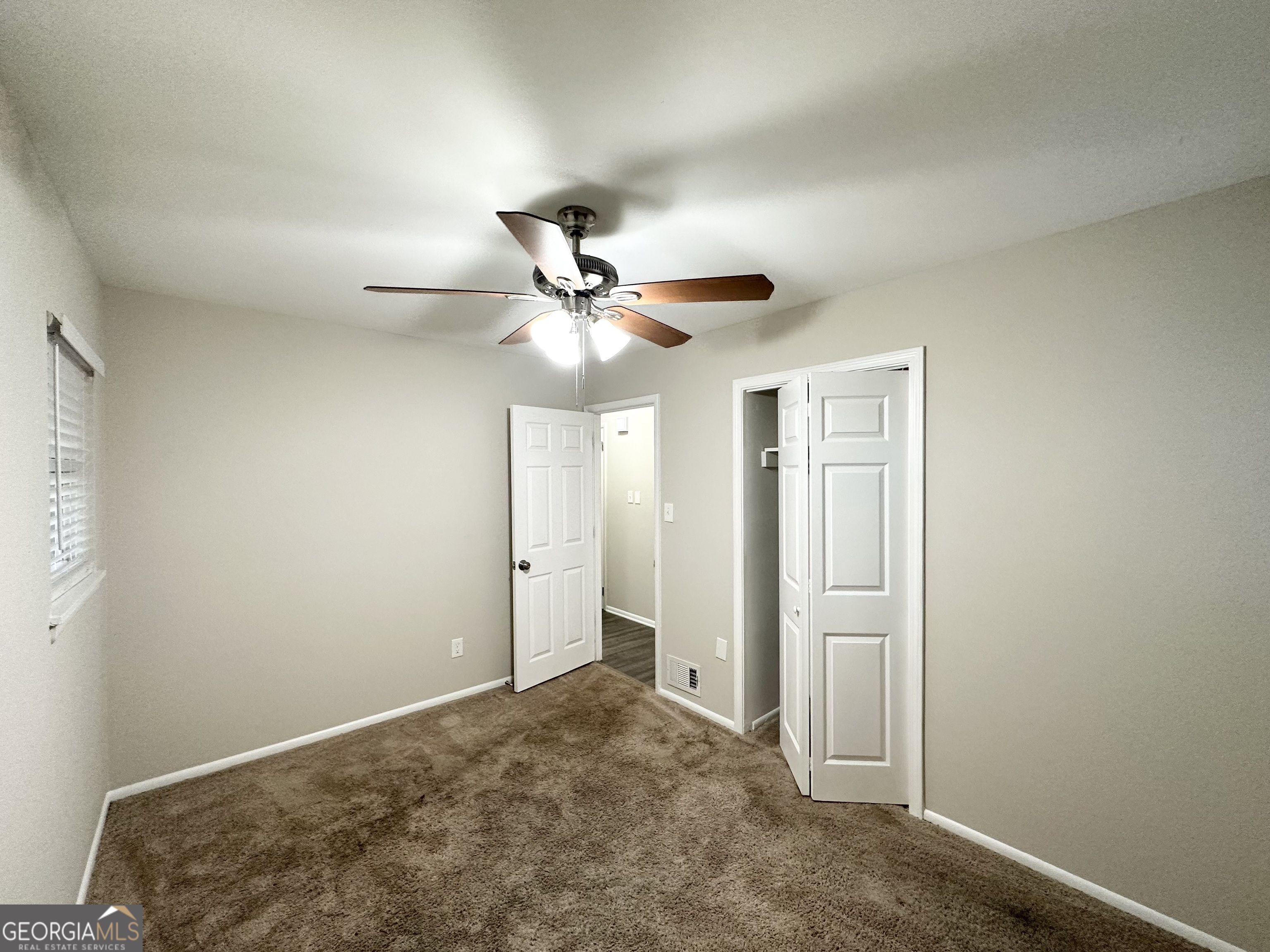 2852 Port Royal Lane Decatur, GA 30034 - Photo 14 of 18 a view of a livingroom with a ceiling fan & entryway