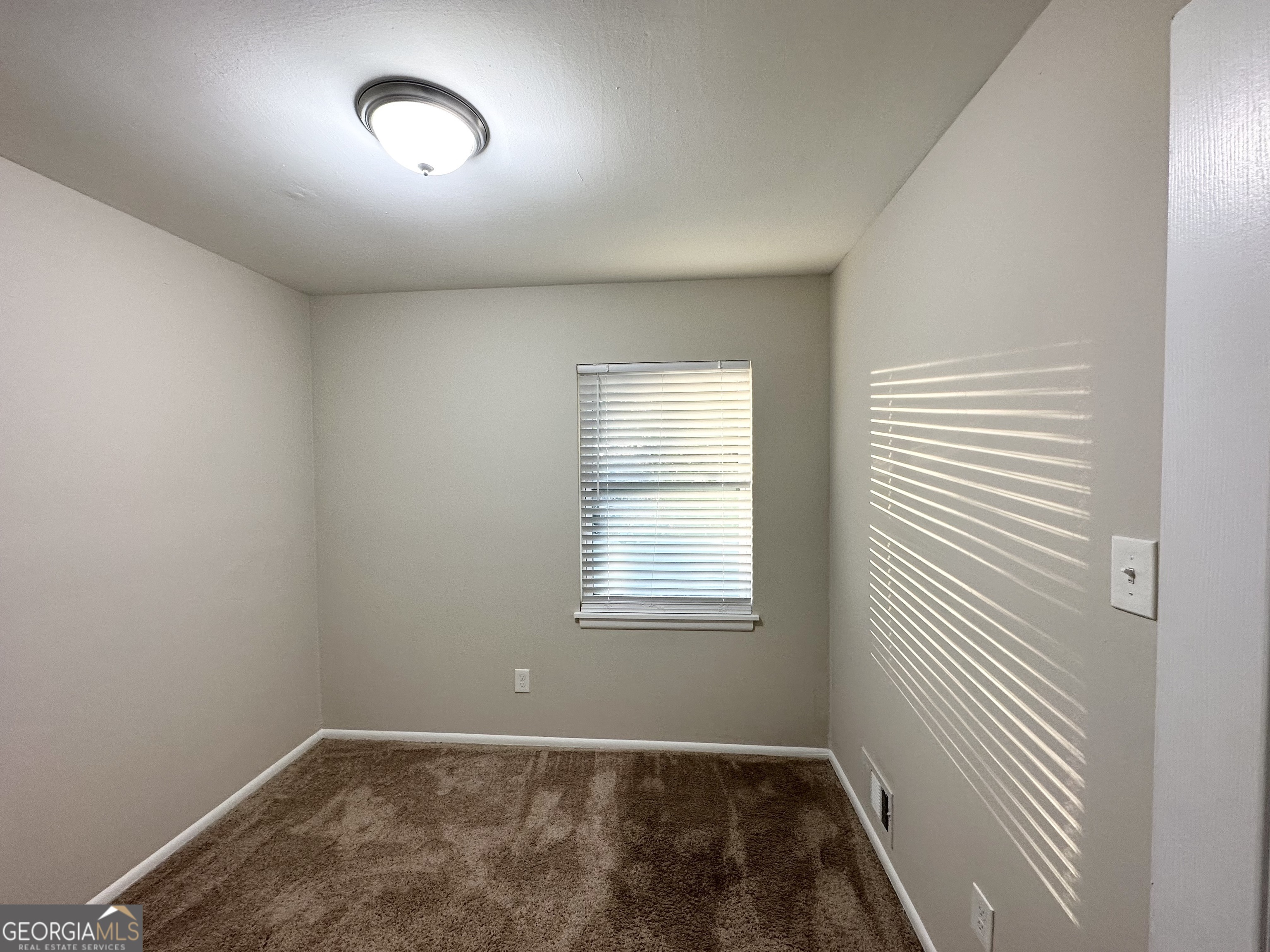 2852 Port Royal Lane Decatur, GA 30034 - Photo 16 of 18 an empty room with a window
