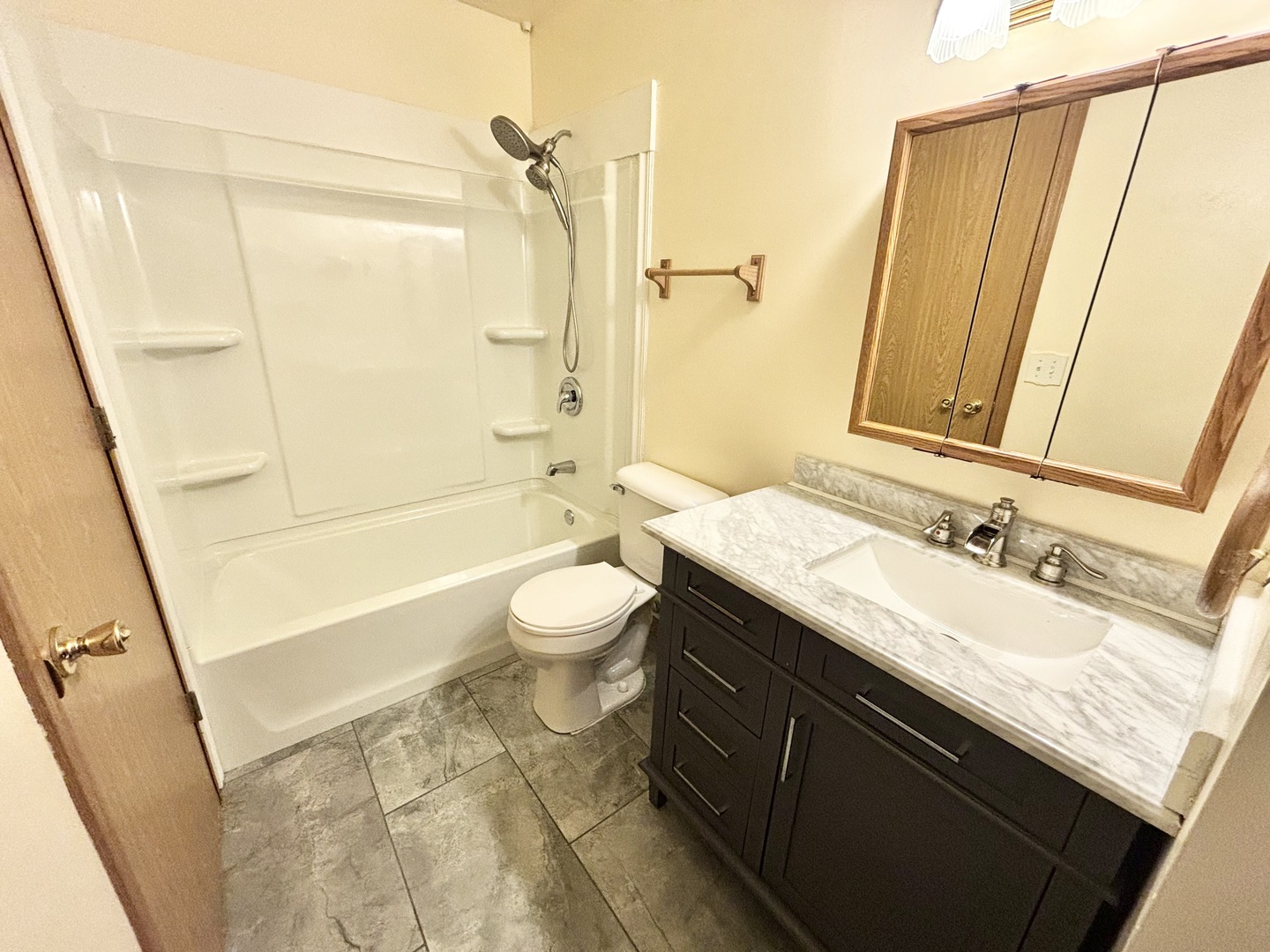 100 Long Beach Road Montgomery, IL 60538 - Photo 9 of 13 a bathroom with a granite countertop sink toilet and shower