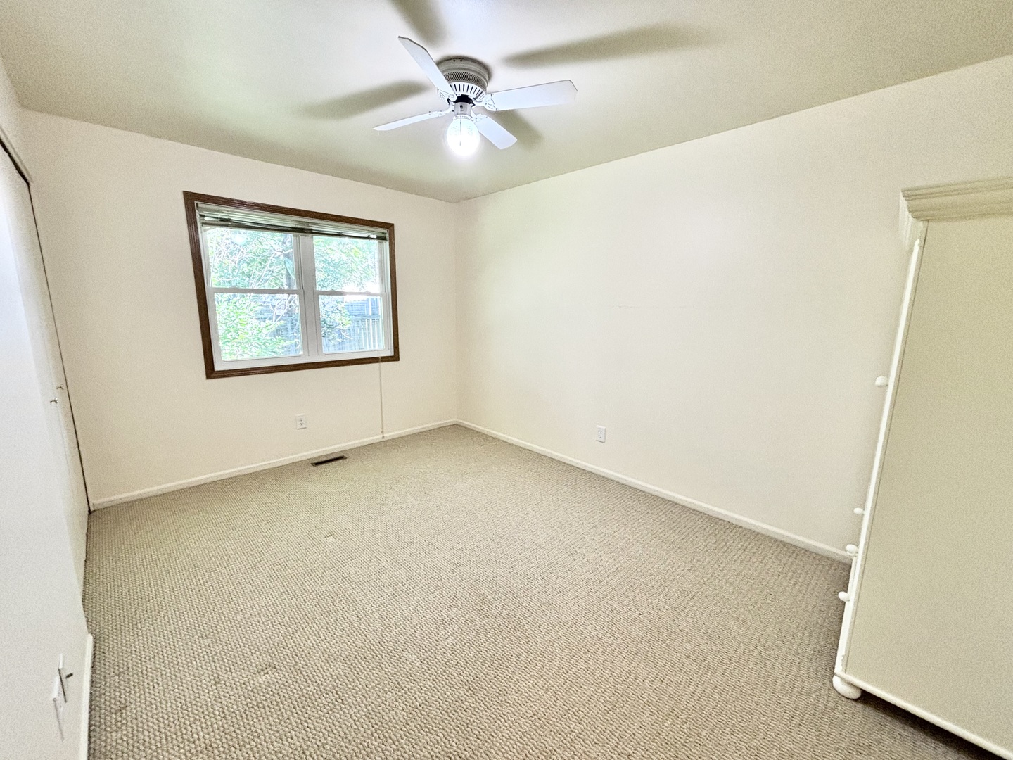 100 Long Beach Road Montgomery, IL 60538 - Photo 10 of 13 an empty room with windows and fan