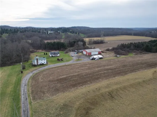 a view of a fire pit with wooden fence