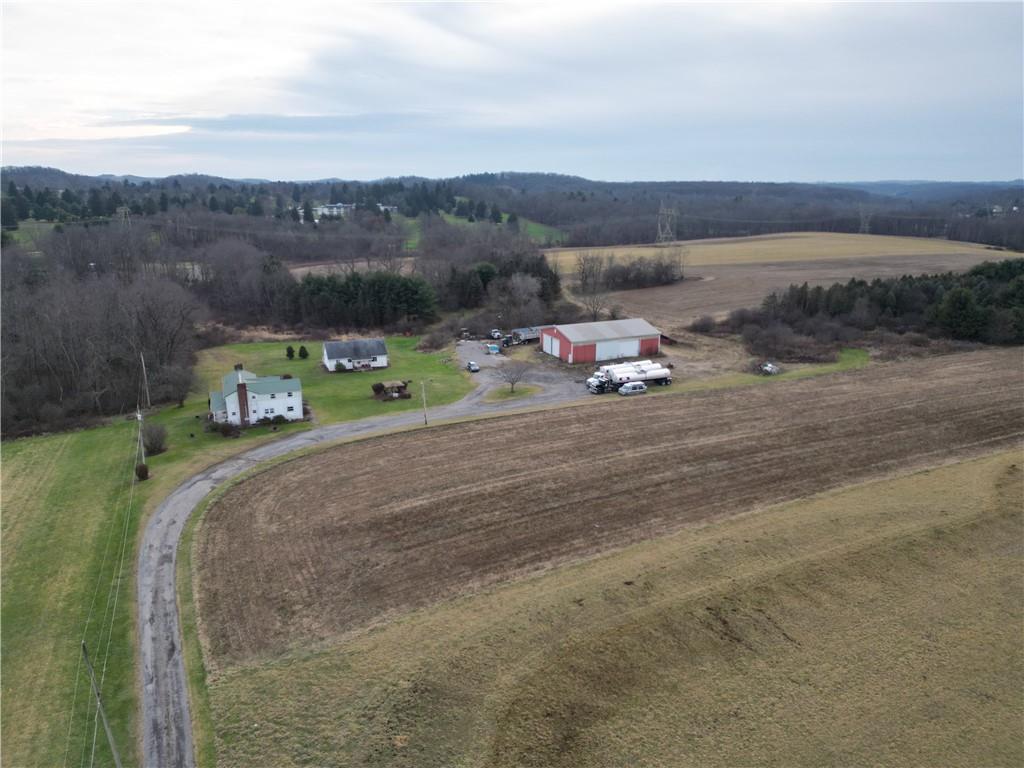 a view of a fire pit with wooden fence