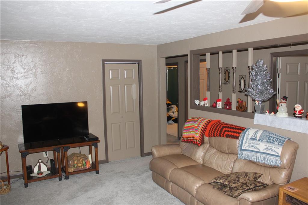 121 Powell Road Butler, PA 16002 - Photo 13 of 49 a living room with furniture and a flat screen tv