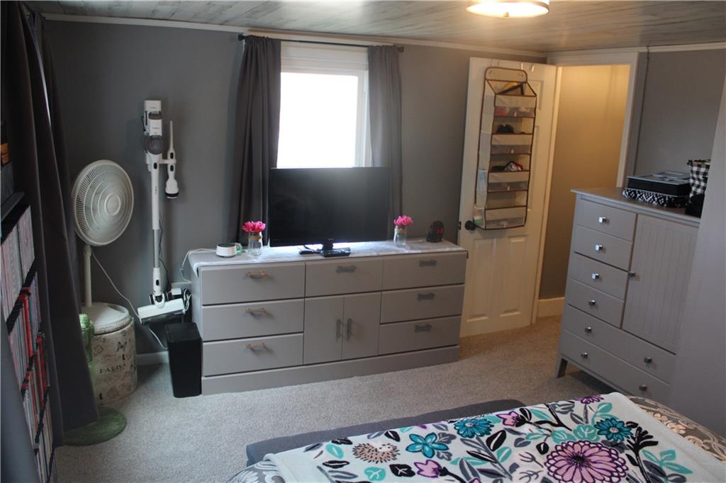 121 Powell Road Butler, PA 16002 - Photo 15 of 49 a bedroom with a bed and a dresser