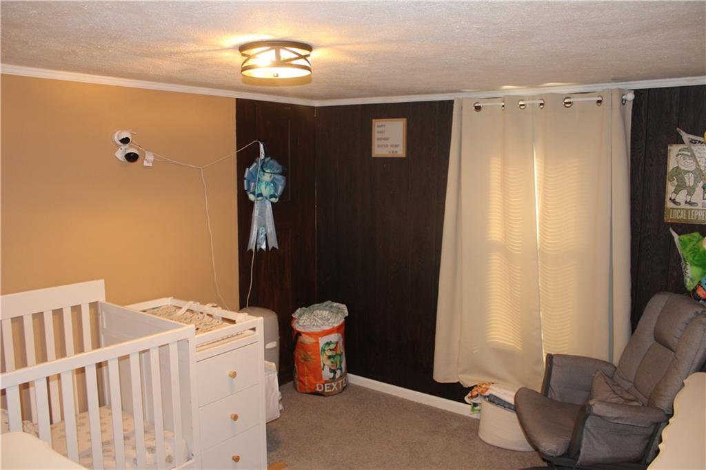121 Powell Road Butler, PA 16002 - Photo 16 of 49 a bedroom with a bed and a window