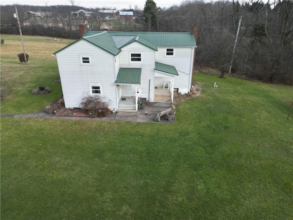 121 Powell Road Butler, PA 16002 - Photo 22 of 49 a aerial view of a house with a yard and sitting area