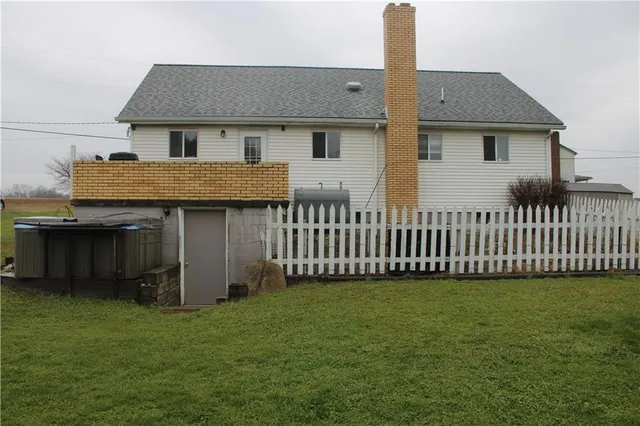 a view of a backyard with table and chairs