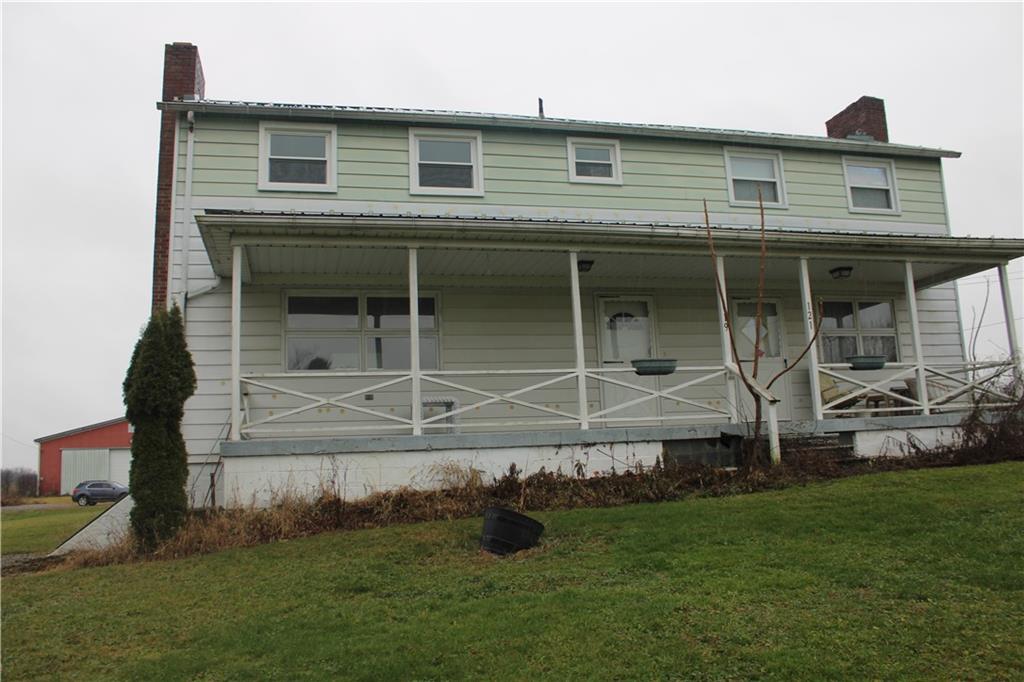 121 Powell Road Butler, PA 16002 - Photo 3 of 49 a front view of a house with garden