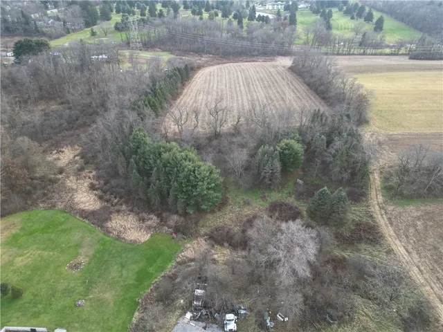 a view of a swimming pool and a yard