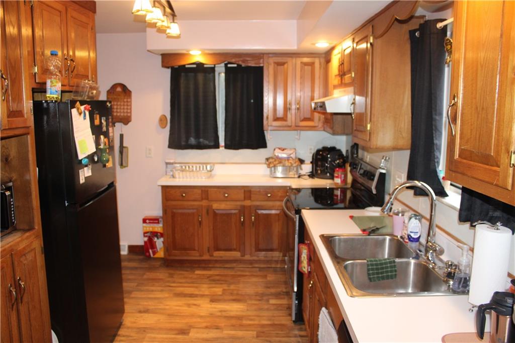 121 Powell Road Butler, PA 16002 - Photo 9 of 49 a kitchen with a sink stove and refrigerator