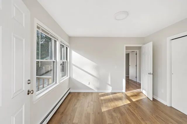 a view of hallway with natural light