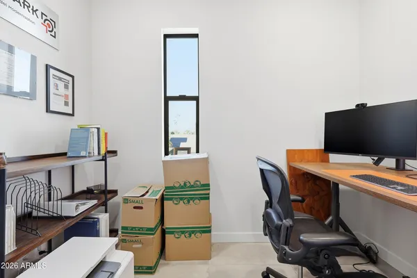 a view of a workspace with furniture