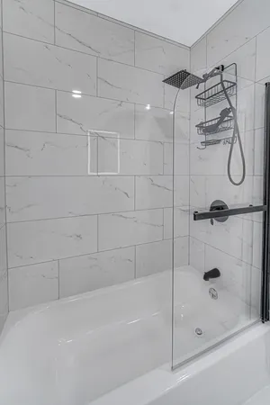 a bathroom with a shower and a bathtub