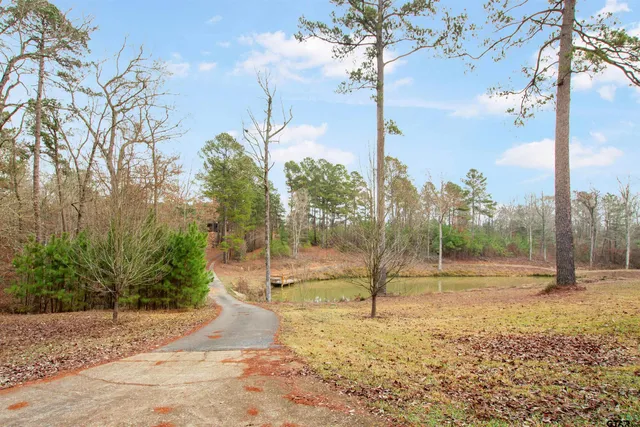 a view of a wooden deck with lake