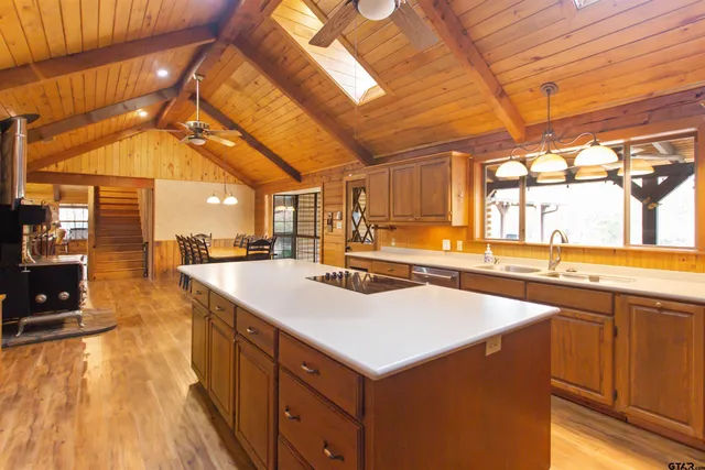 a kitchen with a sink and cabinets