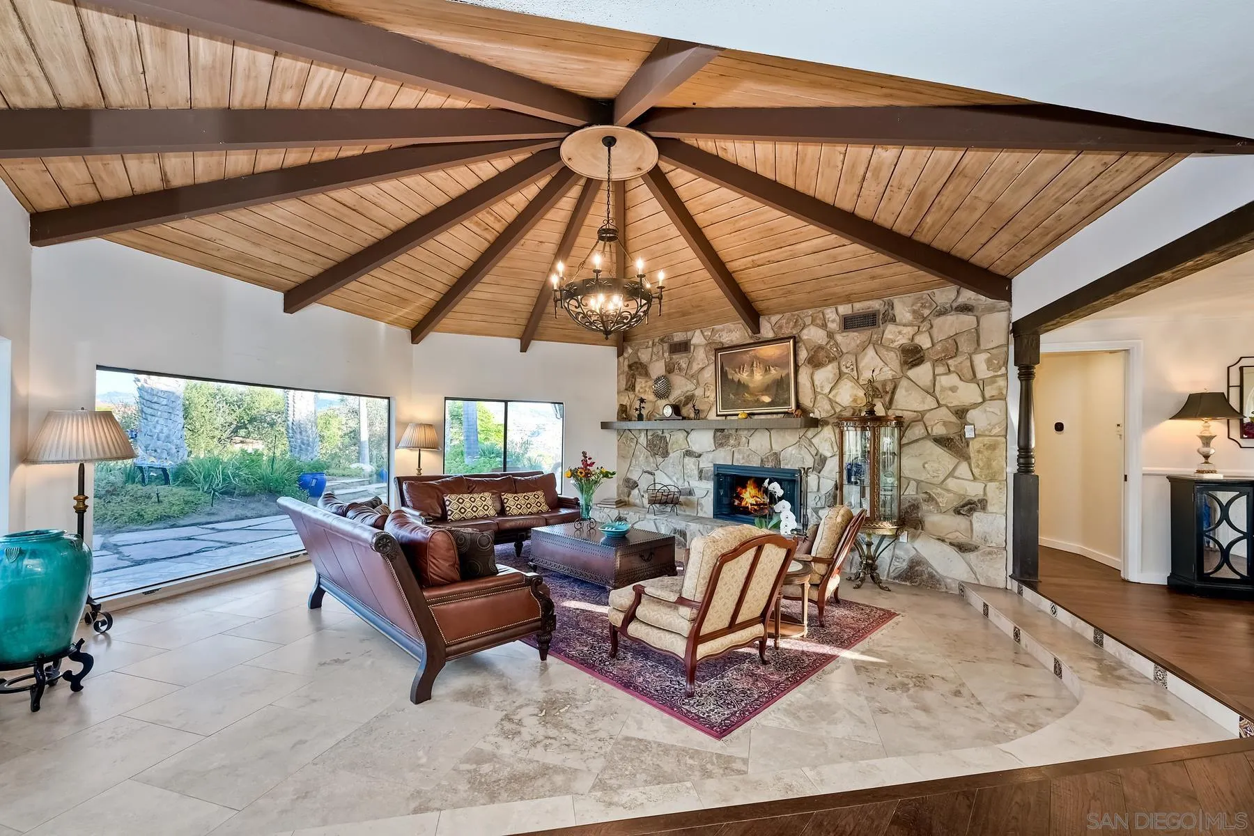 14102 Summit Crest Escondido, CA 92025 - Photo 15 of 52 a living room with furniture a fireplace and a flat screen tv