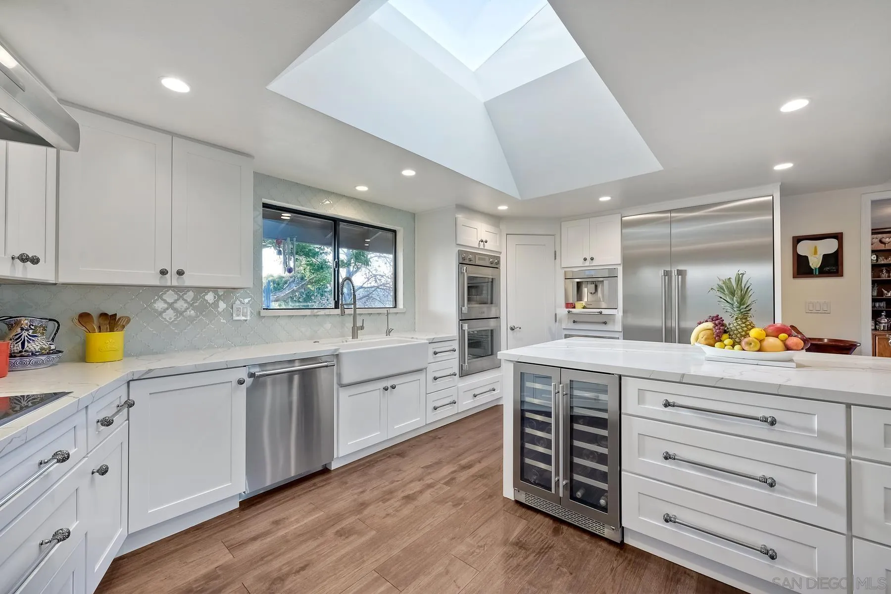 14102 Summit Crest Escondido, CA 92025 - Photo 19 of 52 a kitchen with stainless steel appliances a stove refrigerator and cabinets