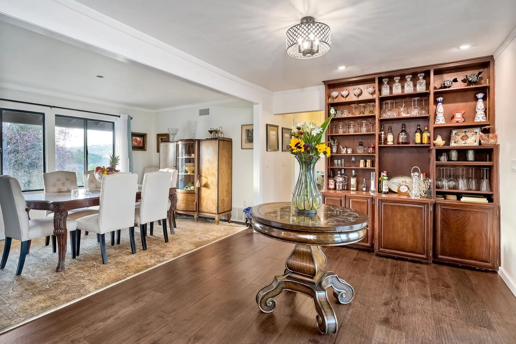 14102 Summit Crest Escondido, CA 92025 - Photo 22 of 52 a room with stainless steel appliances lots of furniture and wooden floors