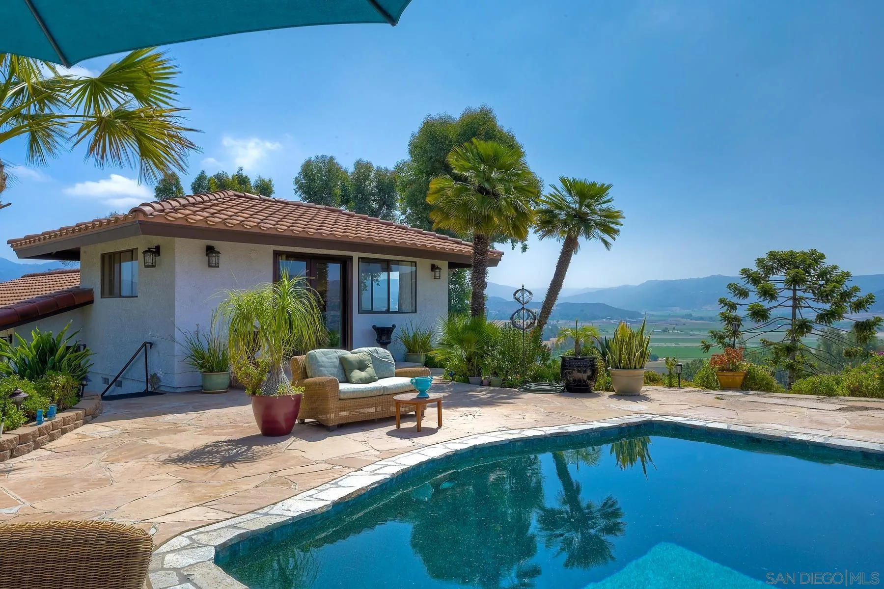 14102 Summit Crest Escondido, CA 92025 - Photo 38 of 52 a front view of a house with garden